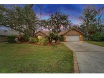 Attractive single-story home with landscaped yard and attached garage at 2913 Aston Ave, Plant City, FL 33566