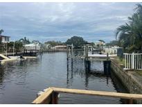 Waterfront property with private dock and boat lift, offering serene canal views at 8540 Riverside, St Petersburg, FL 33702