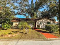 Charming single-story home featuring a well-maintained lawn, vibrant landscaping, and a cozy, inviting exterior at 6700 Turner N St, St Petersburg, FL 33702