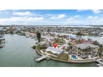 Waterfront property with backyard pool, dock, lush landscaping, and scenic water views at 7800 3Rd S Ave, St Petersburg, FL 33707