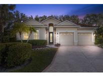 Beautiful home with a two-car garage and lush landscaping at 6207 Skyward Ct, Bradenton, FL 34203
