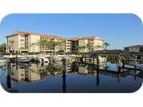 Condo building with waterfront views and boat slips at 1806 Mariner Dr # 318, Tarpon Springs, FL 34689