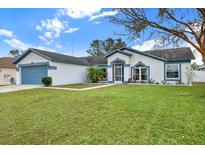One-story home with attached garage, well-maintained lawn and landscaping at 10618 Foxcrest Way, Riverview, FL 33569