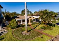 Aerial view of a charming house with a landscaped yard and walkway at 2834 Coffee Pot Ne Blvd, St Petersburg, FL 33704