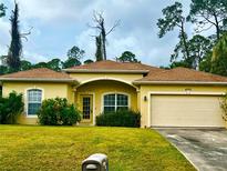 One-story house with a beige exterior and brown roof at 4293 Shrimp Ln, North Port, FL 34286