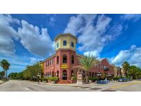Brick building with Metro Market on the ground floor and apartments above at 2010 E Palm Ave # 15305, Tampa, FL 33605