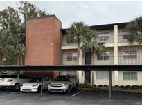 Exterior view of condo building with parking at 2452 Enterprise Rd # 2, Clearwater, FL 33763