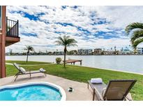 Relaxing backyard oasis with private pool, dock, and stunning water views at 16134 4Th E St, Redington Beach, FL 33708