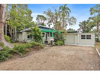 Charming single story home with carport and landscaped yard at 200 57Th S Ave, St Petersburg, FL 33705