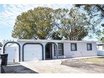 Updated single story home with a two car garage and fenced yard at 6014 N Lois Ave, Tampa, FL 33614