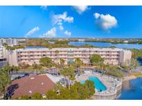 Aerial view of waterfront condo community with pool and lush landscaping at 6315 Shoreline Dr # 3202, St Petersburg, FL 33708