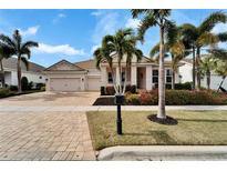 Beautiful one-story home with a two-car garage and lush landscaping at 5316 Fishersound Ln, Apollo Beach, FL 33572