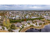Aerial view of waterfront community, showcasing home location and surrounding area at 5610 Golden Isles Dr, Apollo Beach, FL 33572