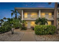 Two-story building exterior with walkway and landscaping at 611 Destiny Dr # 216, Ruskin, FL 33570