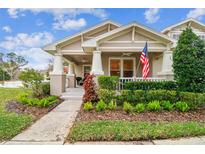 Charming craftsman style home with a well-manicured front yard and porch at 10002 Bentley Way, Tampa, FL 33626