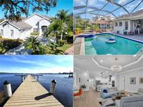 Luxury home with a large yard and circular driveway at 2607 Grand Lakeside Dr, Palm Harbor, FL 34684
