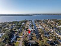 Aerial view of waterfront home with private dock and boat lift at 811 Camellia Ave, Ellenton, FL 34222