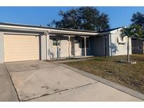 Ranch style home with attached garage and carport at 8757 113Th St, Seminole, FL 33772
