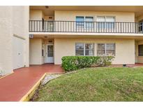 Building exterior showing entrance and landscaping at 12200 Vonn Rd # 1106, Largo, FL 33774