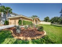 Single-Gathering home with well-manicured lawn and landscaping at 17409 New Cross Cir, Lithia, FL 33547