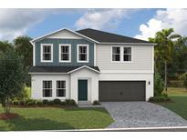 Two-story home with gray and blue siding, dark garage door, and landscaping at 2049 Stillview Pass, Zephyrhills, FL 33541
