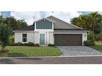 Attractive single-story home with a two-car garage and landscaping at 2103 Stillview Pass, Zephyrhills, FL 33541