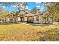 Beautiful one-story home with landscaping and a large yard at 16356 Marquis Rd, Brooksville, FL 34614