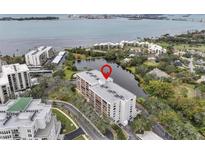 Aerial view of condo building near water at 220 Belleview Blvd # 607, Belleair, FL 33756