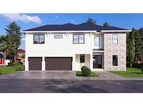Two-story house with stone accents and a two-car garage at 4009 W Euclid Ave, Tampa, FL 33629