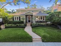 Beautiful two-story home with a manicured lawn and brick pathway at 526 19Th Ne Ave, St Petersburg, FL 33704