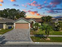 Single-Gathering home with paved driveway and landscaping at 2115 Cattleman Dr, Brandon, FL 33511