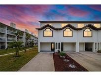 Two-story townhome with attached garage and landscaping at 274 Madeira Cir, St Petersburg, FL 33715