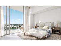 Bright bedroom with large windows and city views; includes a comfy bench at the foot of the bed at 400 Central Ave # 2008, St Petersburg, FL 33701