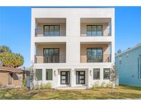 Modern two-story duplex with light-colored facade and private balconies at 1911 W North B St # B, Tampa, FL 33606