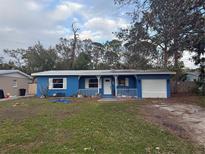 Cute blue house with carport and small front yard at 4933 Venetian Ne Blvd, St Petersburg, FL 33703