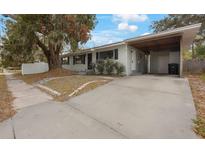 House exterior with carport and landscaped yard at 313 10Th N Ave, Safety Harbor, FL 34695