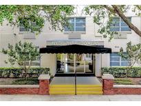 Hyde Park Towers building entrance with awning, steps, and landscaping at 406 S Cedar Ave # 502, Tampa, FL 33606