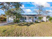 White single-story home with landscaped lawn and modern curb appeal at 5501 7Th N Ave, St Petersburg, FL 33710