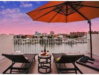 Relaxing balcony with cityscape views and lounge chairs at 145 Brightwater Dr # 2, Clearwater Beach, FL 33767