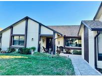 Charming single-story home featuring mature landscaping and a welcoming front entrance at 2217 Sequoia Dr, Clearwater, FL 33763