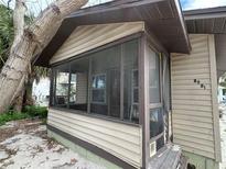 Quaint beach cottage with screened porch, needs renovation at 8581 W Gulf Blvd, Treasure Island, FL 33706