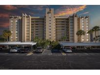 Exterior view of building with parking area at 2621 Cove Cay Dr # 205, Clearwater, FL 33760