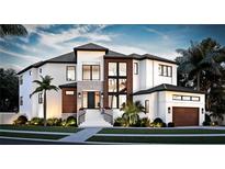 Stunning modern home with two-toned exterior, and palm trees at 2622 N Dundee St, Tampa, FL 33629