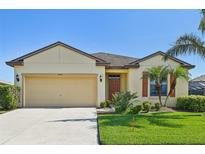 Attractive single-story home with a two-car garage and landscaped lawn at 5808 111Th E Ave, Parrish, FL 34219