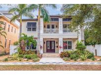 Two-story house with double front doors, landscaping, and walkway at 310 8Th N Ave, St Petersburg, FL 33701