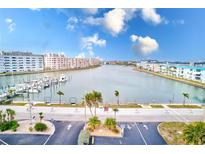 Aerial view of waterfront community with boat slips and lush landscaping at 3010 59Th S St # 201, Gulfport, FL 33707