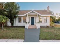 Charming bungalow with a classic facade, updated with a fresh coat of paint and landscaping at 4056 18Th S Ave, St Petersburg, FL 33711