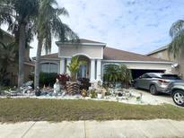 Single-Gathering home with landscaped yard and attached garage at 10537 Sky Flower Ct, Land O Lakes, FL 34638