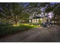 Charming Bungalow with a spacious front yard and mature tree at 1217 E Flora St, Tampa, FL 33604