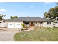 Updated ranch home with 2-car garage and landscaped yard at 1338 Whitacre Dr, Clearwater, FL 33764